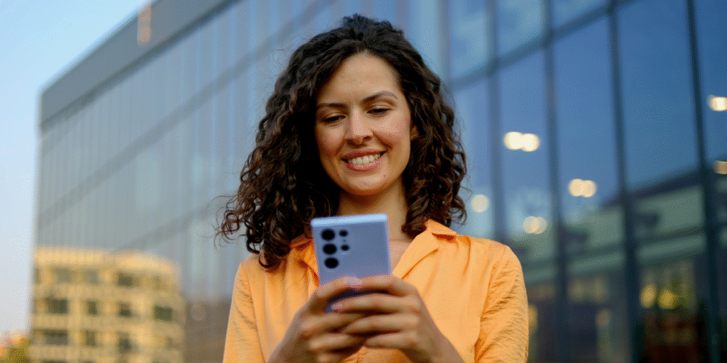 Woman smiling at phone
