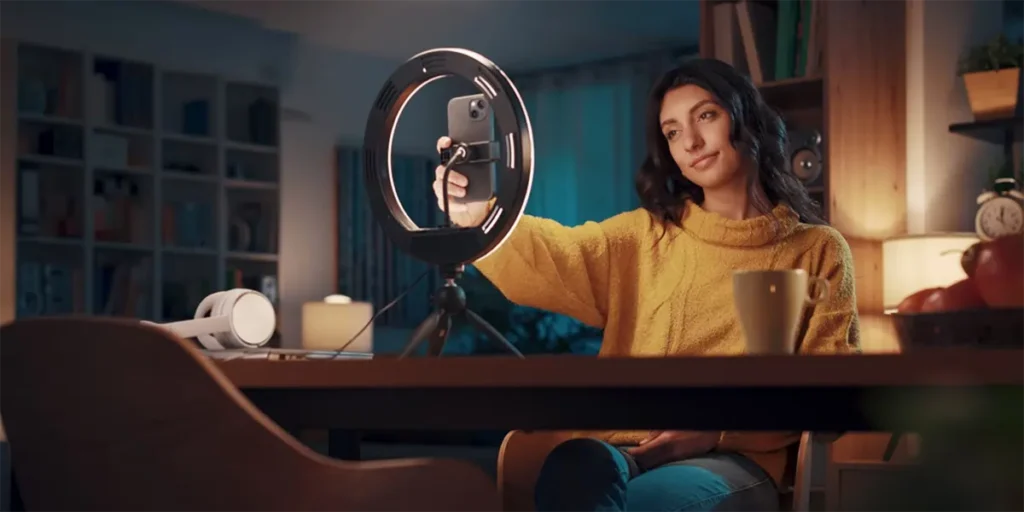 UGC Creator in front of a phone camera and ring light
